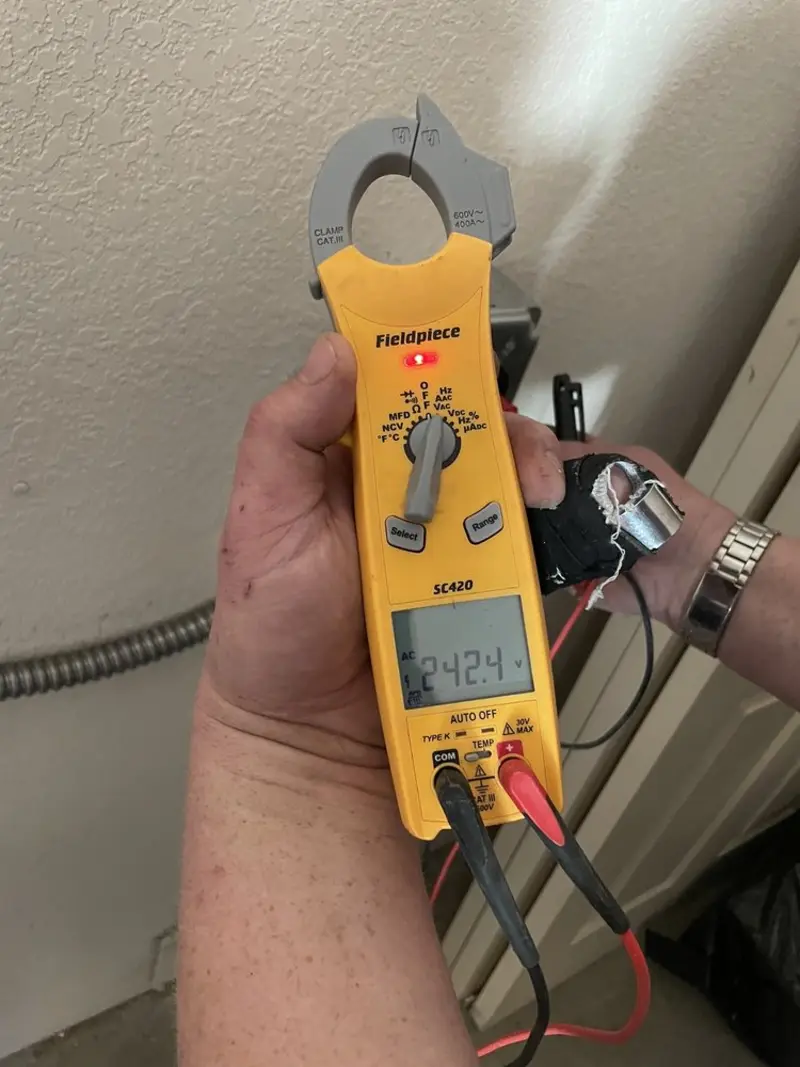 Voltage testing with clamp meter during Ceiling Fan Installation in Pennsbury